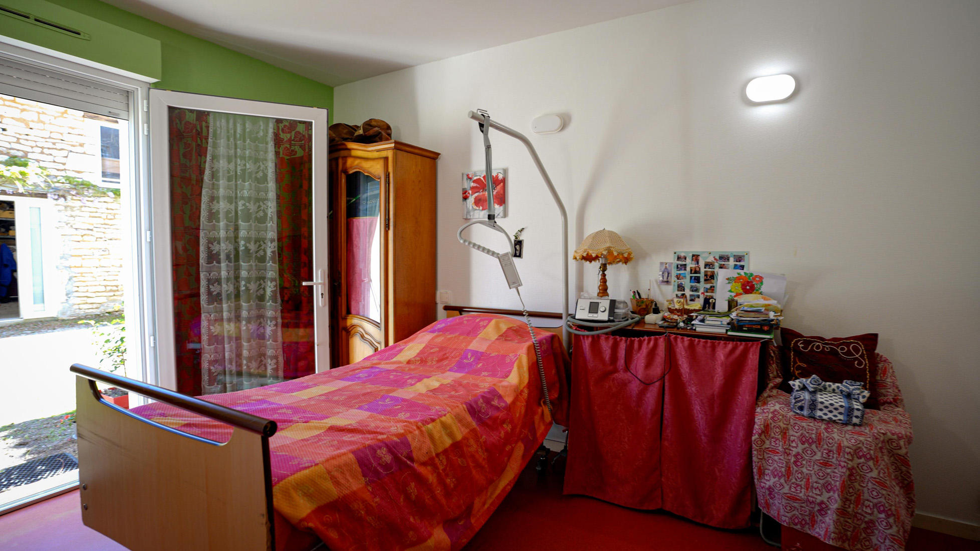 Cozy bedroom with medical bed and patient lift